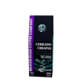 A 12oz box of Broken Road Coffee Company Cerrado Chiapas coffee, featuring a dark green and black design with a purple side banner and a scenic mountain illustration.