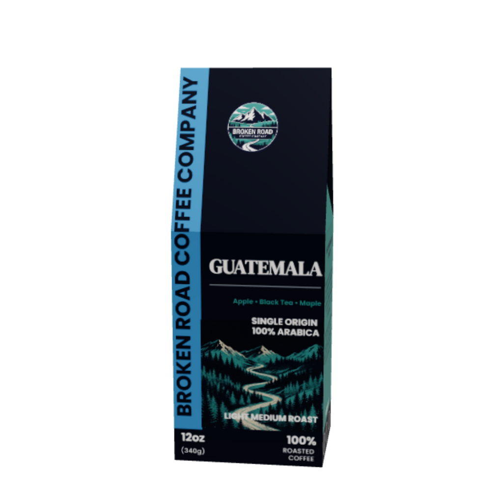A 12oz bag of Broken Road Coffee Company Guatemala single origin coffee, featuring a dark navy blue package with a scenic mountain illustration and white text, set against a plain white background.