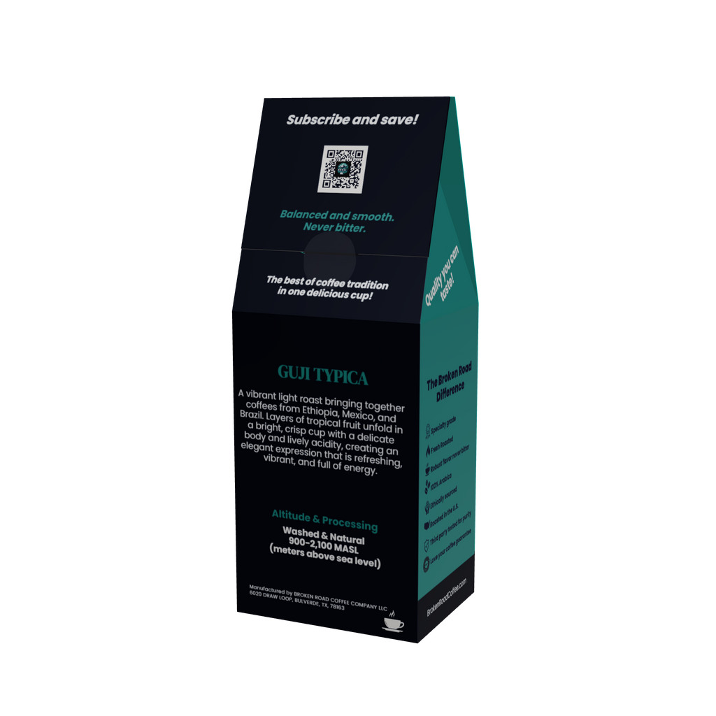 A tall, black coffee bag packaging box for Guji Typica, shown on a plain white background. The box features dark teal side panels and black front panels with white and teal text detailing the coffee's origin, flavor profile, and processing methods.