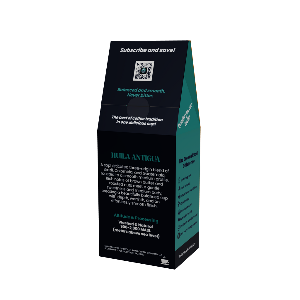 A tall, black coffee bag package with teal side panels and white text, photographed on a plain white background. The front shows a QR code and the variety name HUILA ANTIGUA.