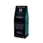 A tall, black coffee bag package with teal side panels and white text, photographed on a plain white background. The front shows a QR code and the variety name HUILA ANTIGUA.