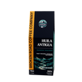 A tall, navy blue coffee bag package with teal side panels and white text, photographed on a plain white background. The front shows the coffee name HUILA ANTIGUA.