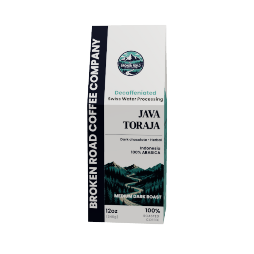 A 12oz box of Broken Road Coffee Company Java Toraja Decaffeinated coffee, featuring a white and black package design with a dark chocolate and herbal flavor label.
