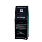 A tall, dark green and black coffee bag package for 'PERU' from the brand Broken Road Coffee Company